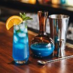 blue curacao mocktail with bar tools
